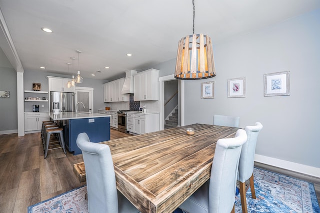 dining space featuring recessed lighting, dark wood-style flooring, baseboards, and stairs