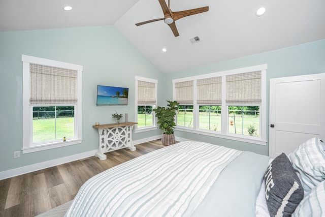 bedroom featuring multiple windows, wood finished floors, recessed lighting, a ceiling fan, and baseboards