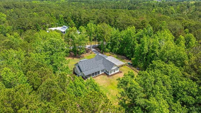 view from above of property with a forest