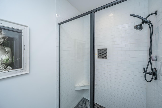 bathroom featuring a shower stall
