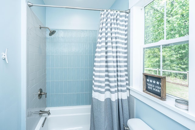full bathroom with shower / bath combo and toilet