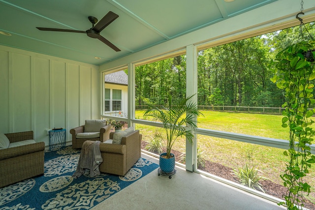 sunroom with a ceiling fan