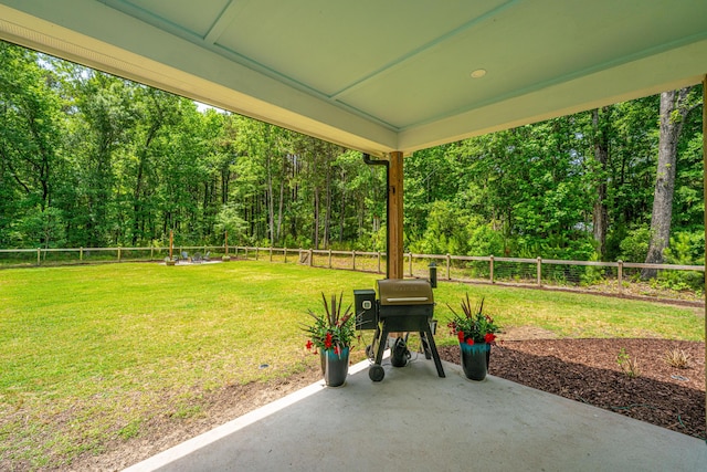 view of patio / terrace with a view of trees