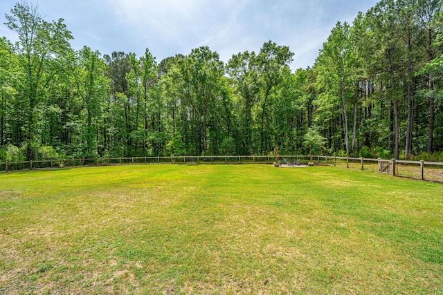 view of yard featuring a wooded view