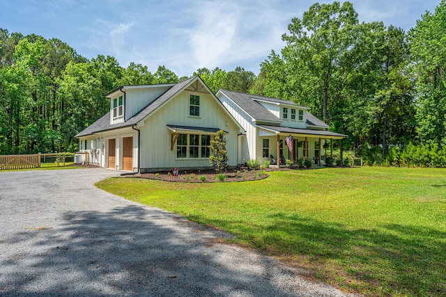 modern farmhouse with gravel driveway, french doors, covered porch, and board and batten siding
