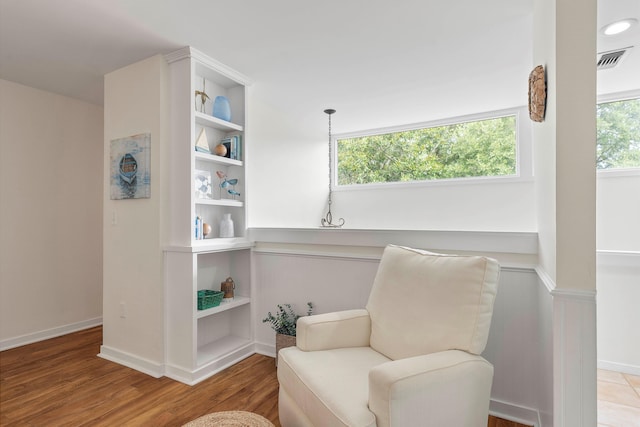 sitting room featuring hardwood / wood-style flooring