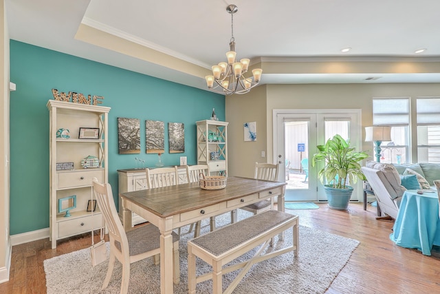 269 Village Stone Cir, Summerville, SC 29483 - dining area with ornamental molding, a chandelier, wood finished floors, recessed lighting, and a raised ceiling