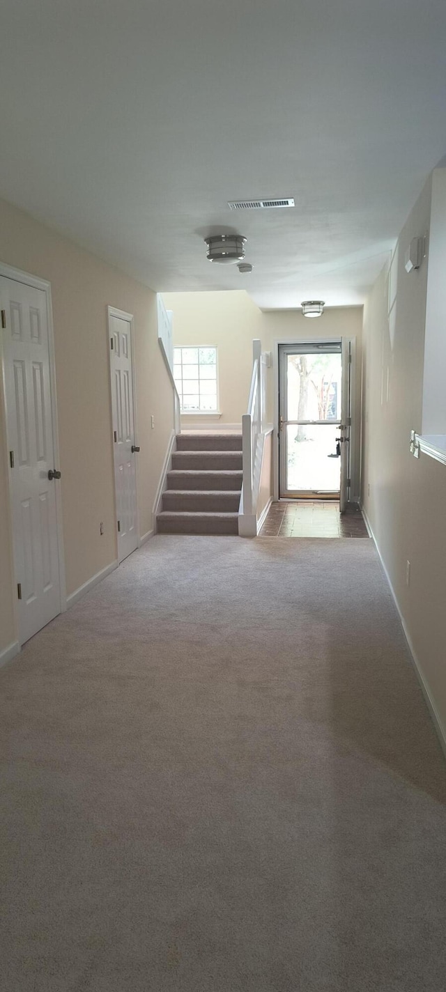 empty room featuring light carpet