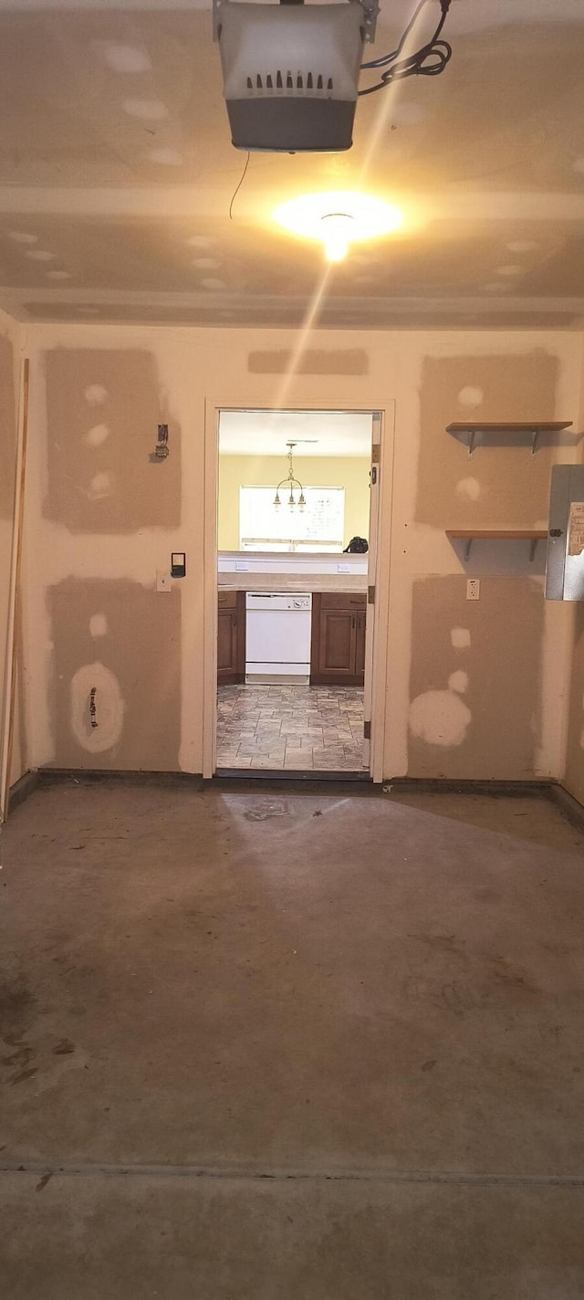 bathroom featuring electric panel and concrete floors