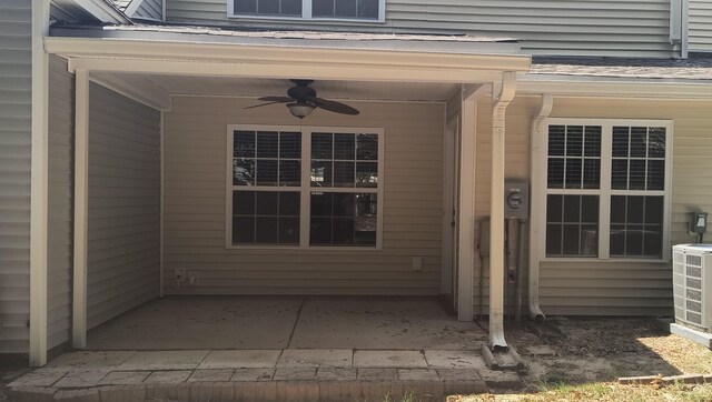 property entrance with central AC, ceiling fan, and a patio