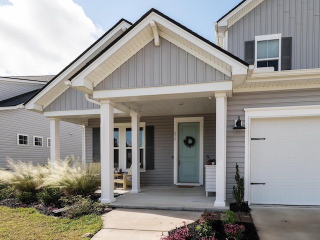 view of front of home featuring covered porch and a garage