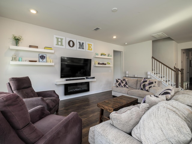 living room with dark hardwood / wood-style flooring