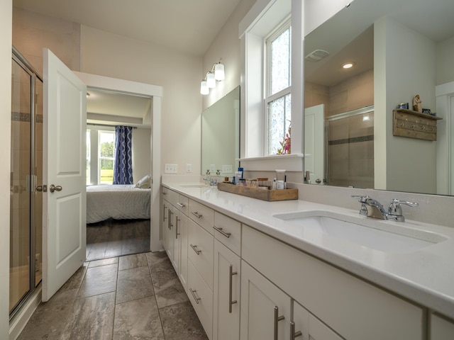 bathroom featuring hardwood / wood-style floors, vanity, and an enclosed shower