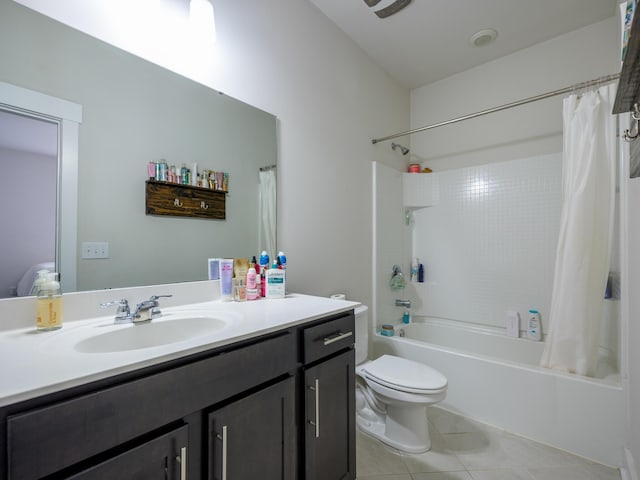 full bathroom with tile patterned floors, shower / bath combination with curtain, toilet, and vanity