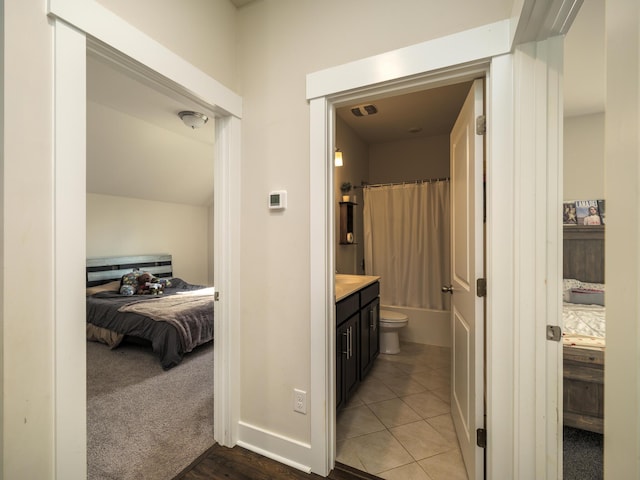 full bathroom with tile patterned flooring, vanity, toilet, and shower / bath combo with shower curtain