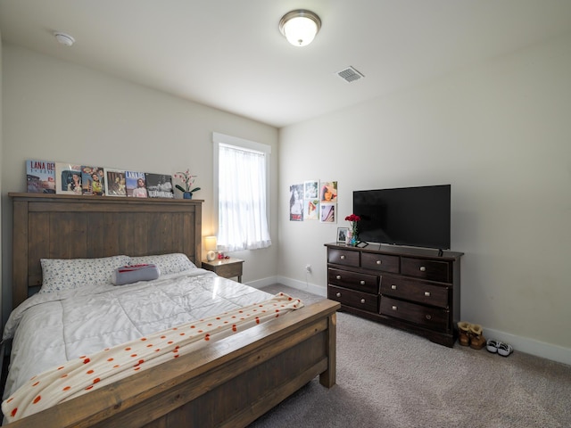 bedroom with light carpet