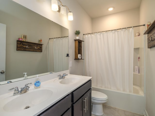 full bathroom featuring tile patterned flooring, vanity, shower / tub combo, and toilet