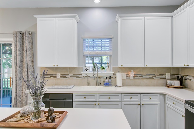 kitchen with decorative backsplash, a sink, recessed lighting, and white cabinetry