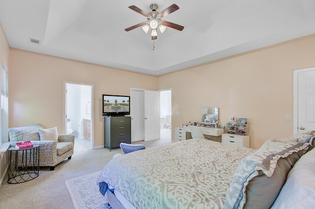 bedroom with visible vents, light carpet, ensuite bath, baseboards, and ceiling fan