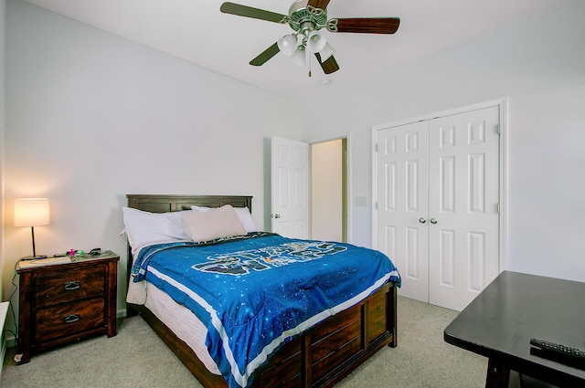 bedroom with carpet, a closet, and a ceiling fan