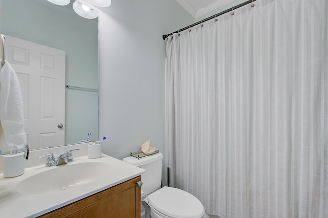 bathroom featuring crown molding, vanity, a shower with shower curtain, and toilet