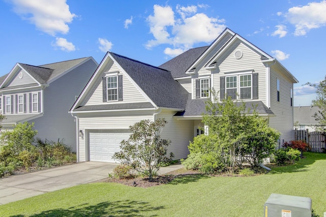 traditional home featuring concrete driveway, fence, a garage, a shingled roof, and a front yard