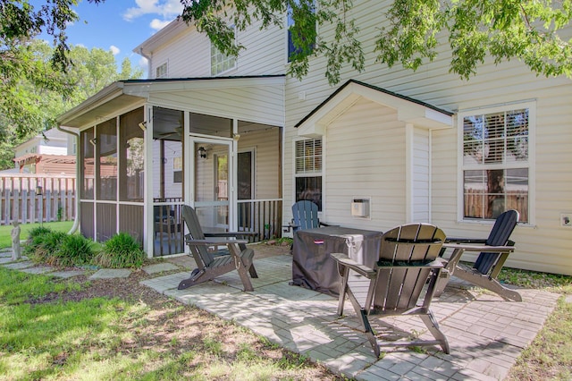 rear view of house featuring a patio area, a sunroom, and fence