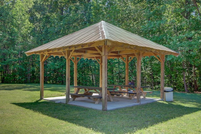 view of property's community featuring a gazebo, a yard, and a patio