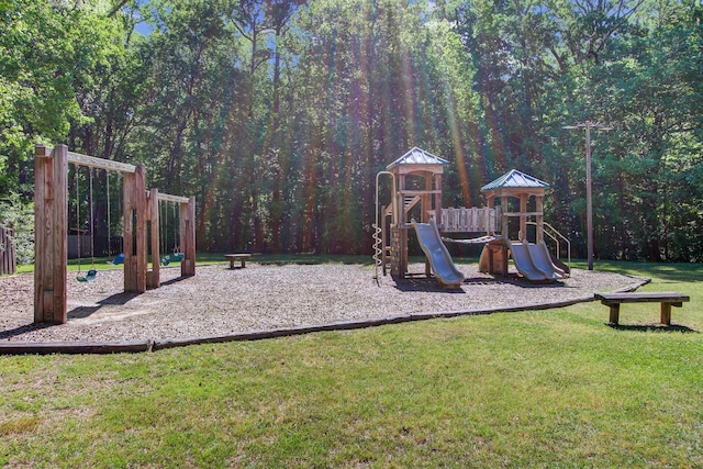 community jungle gym with a lawn