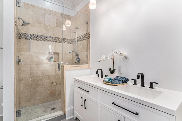 bathroom featuring vanity, an enclosed shower, and crown molding