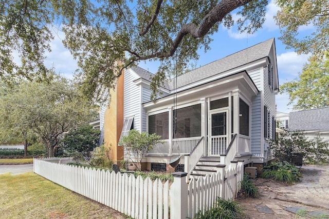 view of front of property with a sunroom