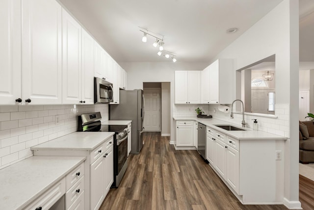 1971 N Smokerise Way, Mount Pleasant, SC 29466 - kitchen with dark wood-type flooring, white cabinetry, a sink, backsplash, and stainless steel appliances