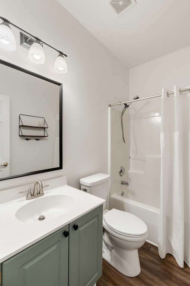 1971 N Smokerise Way, Mount Pleasant, SC 29466 - bathroom featuring visible vents, wood finished floors, vanity, toilet, and shower / bathtub combination with curtain