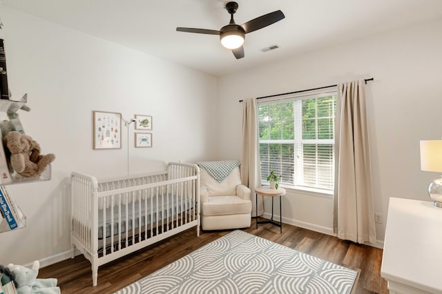 1971 N Smokerise Way, Mount Pleasant, SC 29466 - bedroom featuring a nursery area, baseboards, visible vents, and wood finished floors