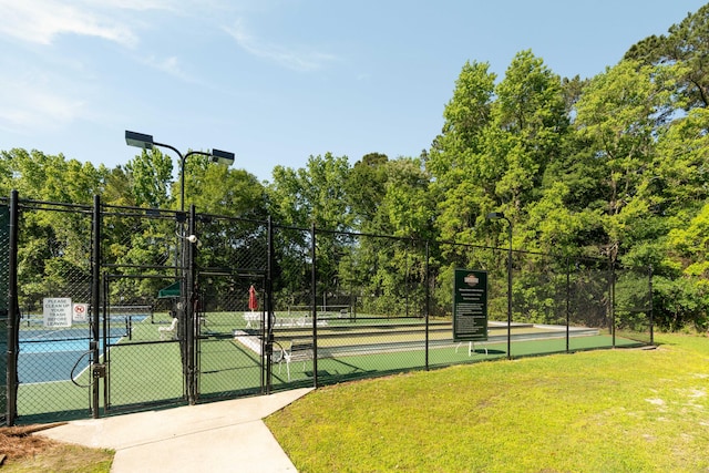 1971 N Smokerise Way, Mount Pleasant, SC 29466 - view of tennis court featuring a lawn, fence, and a gate