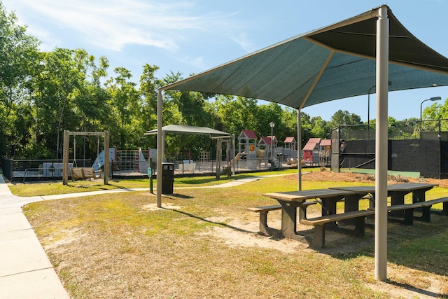 1971 N Smokerise Way, Mount Pleasant, SC 29466 - surrounding community with a lawn, fence, and playground community
