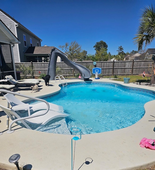 view of pool featuring a water slide