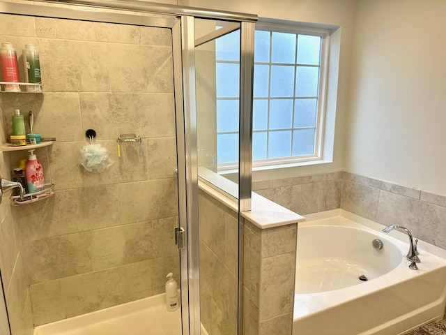 bathroom with shower with separate bathtub