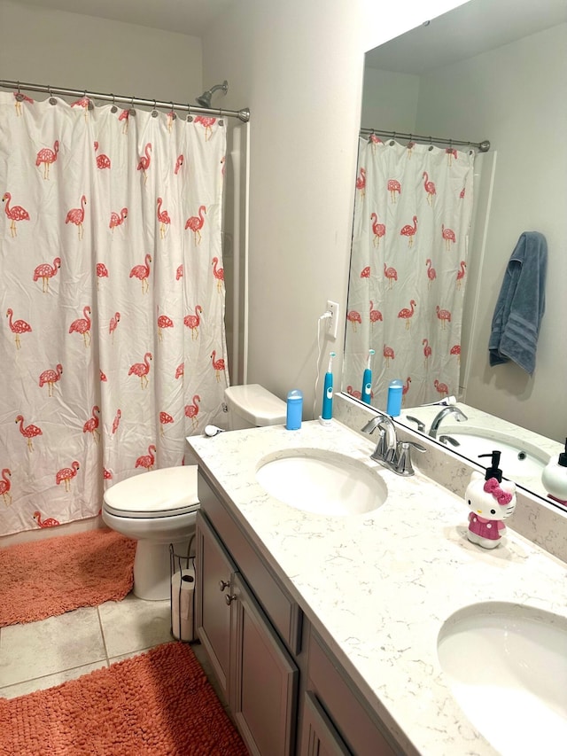 bathroom featuring a shower with shower curtain, vanity, toilet, and tile patterned floors