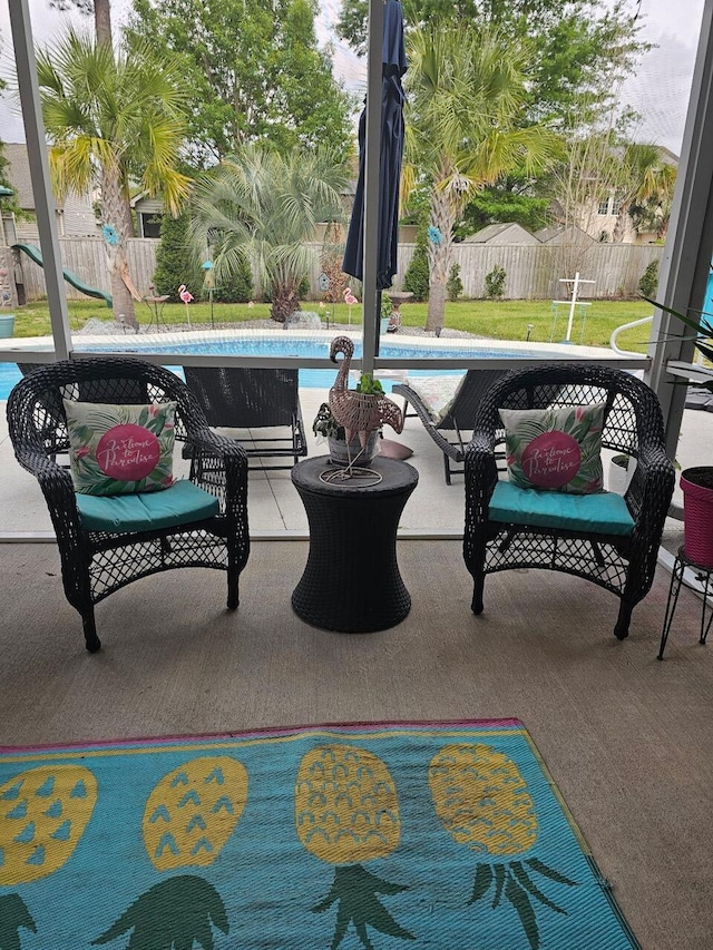 view of patio with a fenced in pool