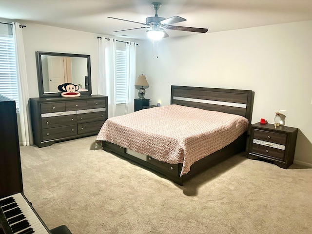 bedroom with light carpet and ceiling fan