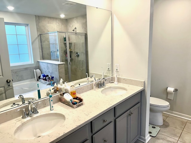 full bathroom featuring toilet, plus walk in shower, tile patterned flooring, and vanity