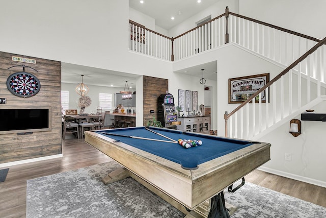 playroom featuring wood finished floors, recessed lighting, pool table, baseboards, and a chandelier