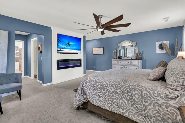 carpeted bedroom with ceiling fan