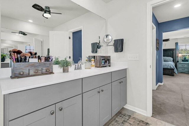 bathroom featuring ceiling fan and vanity