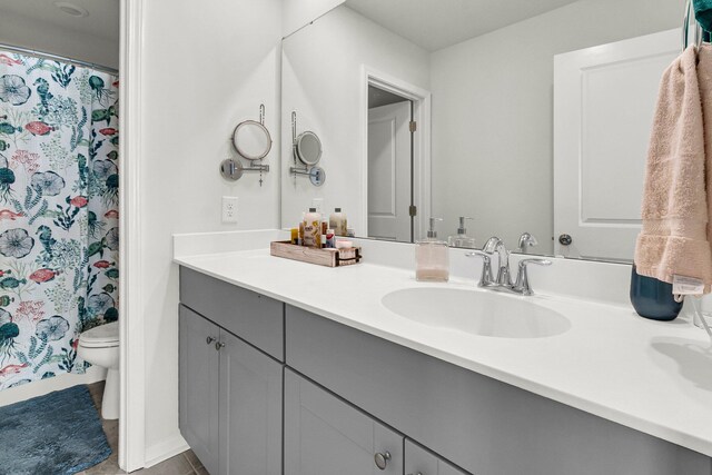 bathroom with toilet and vanity