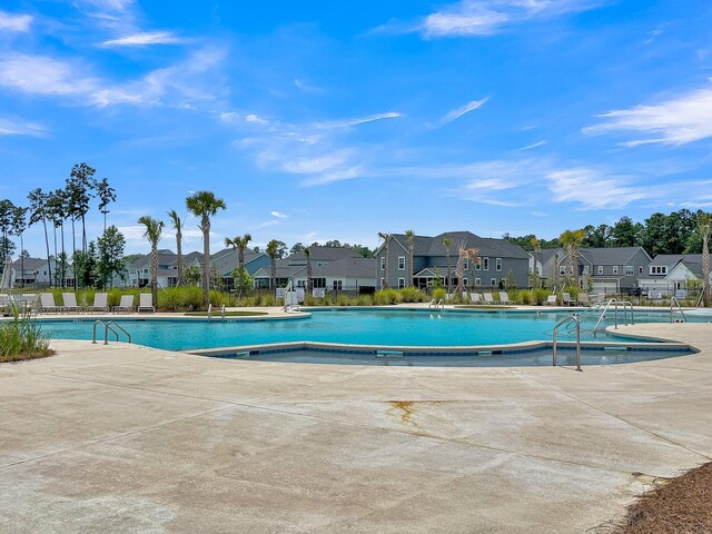 view of pool featuring a patio area