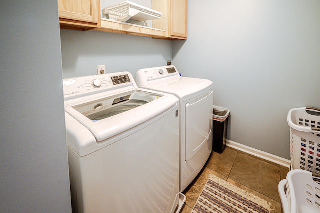 8009 Indian Hill Dr, Hanahan, SC 29410 - laundry area featuring baseboards, cabinet space, light tile patterned flooring, and washing machine and clothes dryer