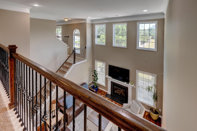 8009 Indian Hill Dr, Hanahan, SC 29410 - stairway with crown molding, recessed lighting, a fireplace with flush hearth, and a healthy amount of sunlight