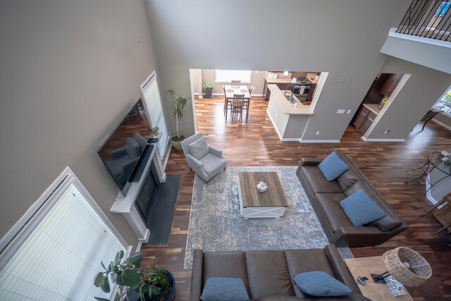 8009 Indian Hill Dr, Hanahan, SC 29410 - living area with baseboards, wood finished floors, and a towering ceiling